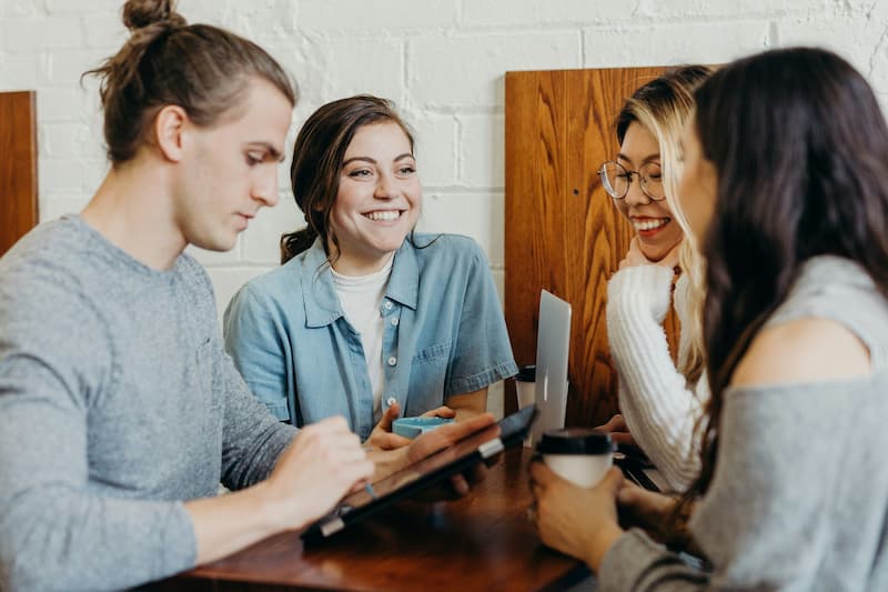 Four people sat round a table